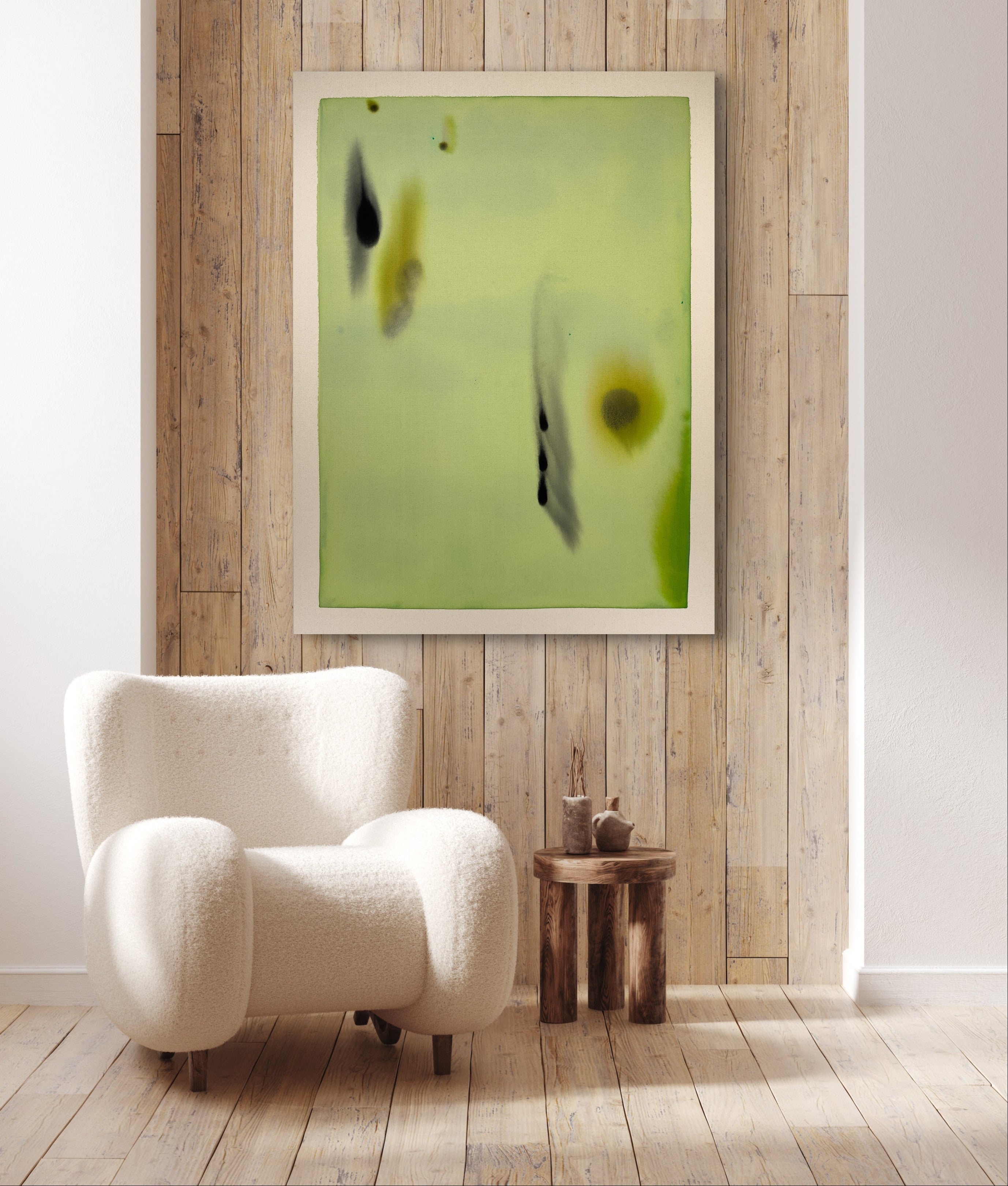 White armchair in a room with a wooden wall and abstract painting