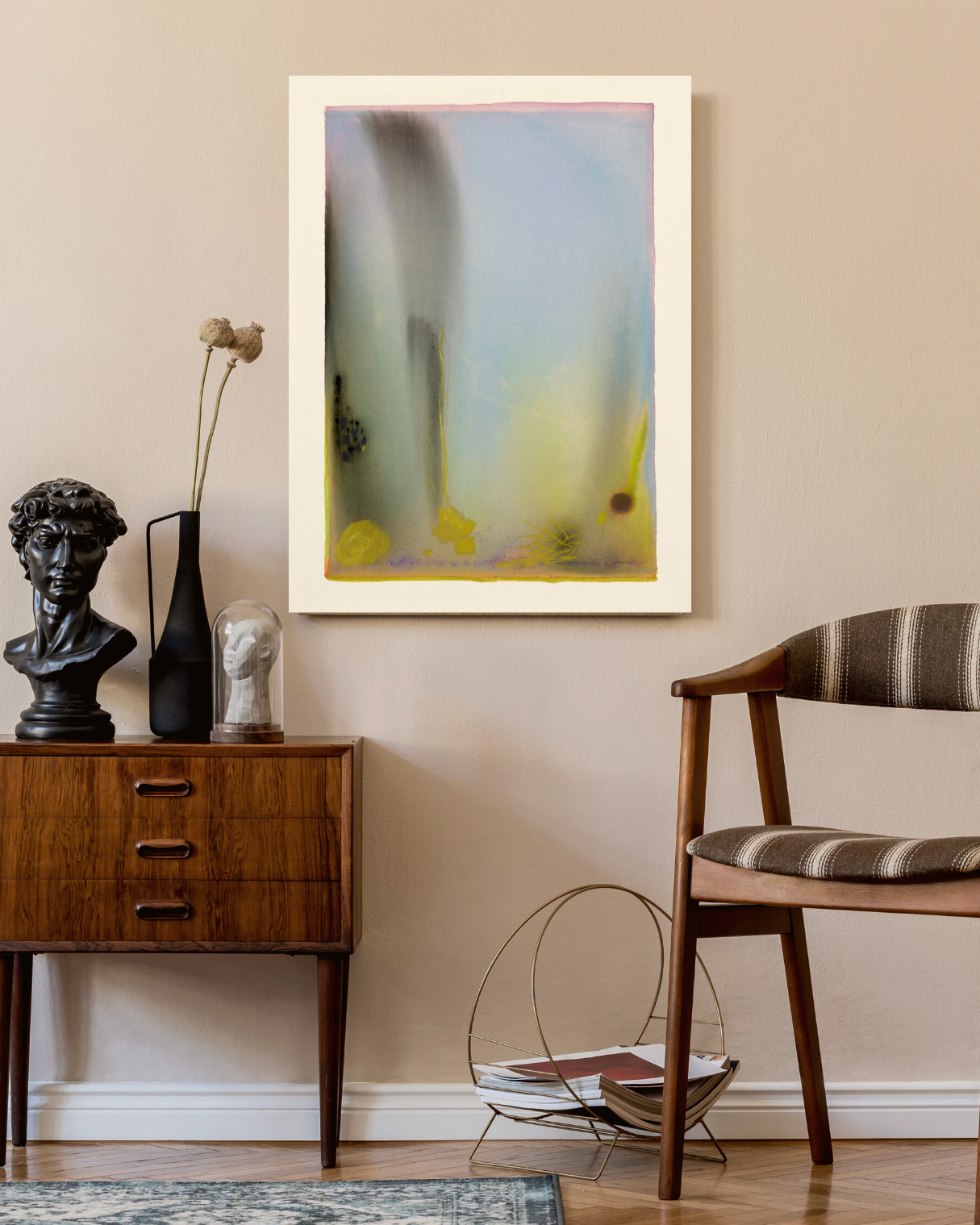 Living room interior with a wooden sideboard, chair, and abstract painting on the wall.