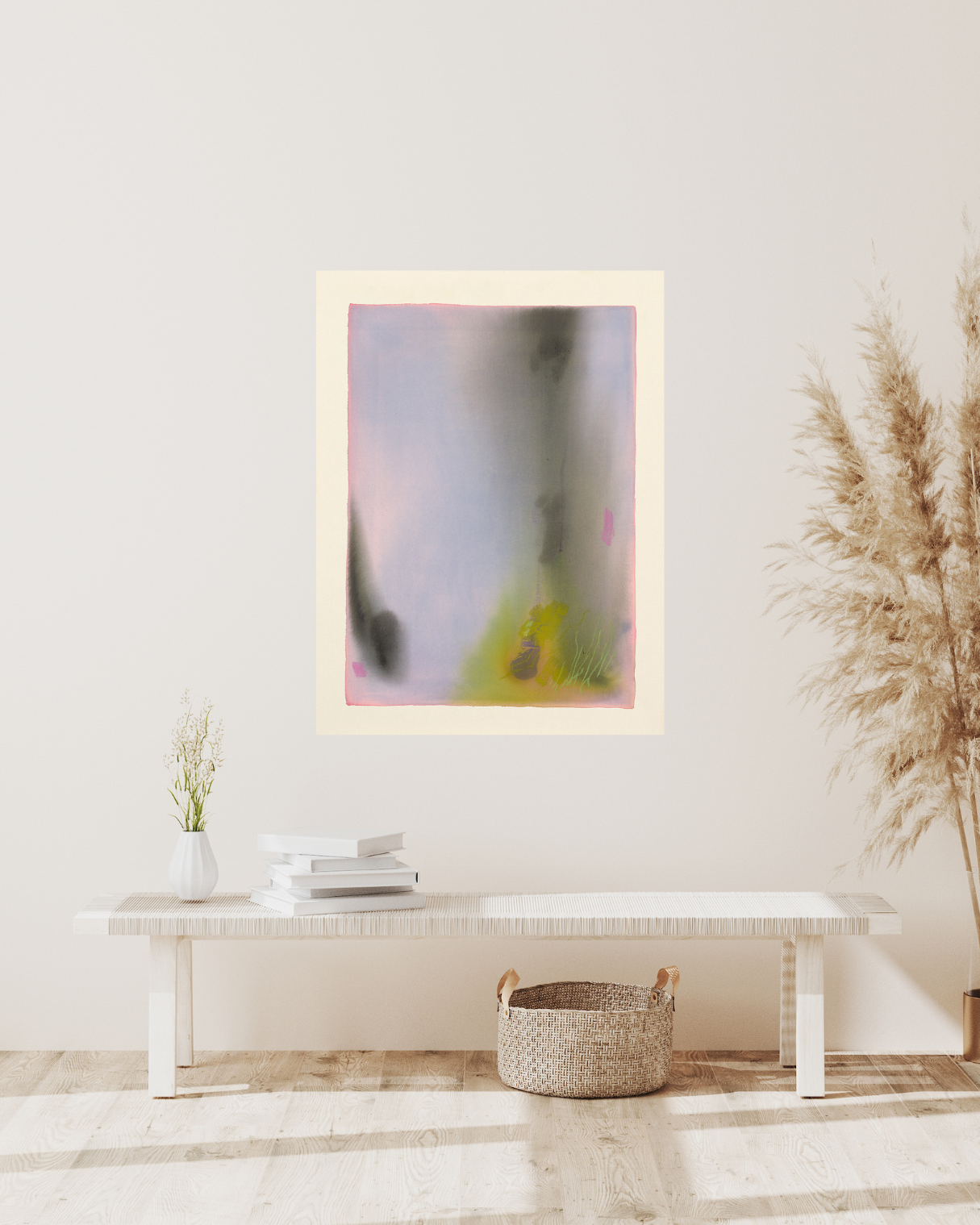 Abstract painting on a wall above a white table with decor items.