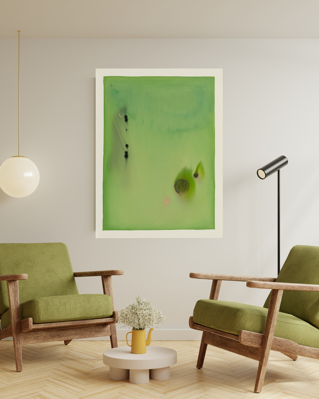 Modern living room with green chairs, a coffee table, and artwork on the wall.
