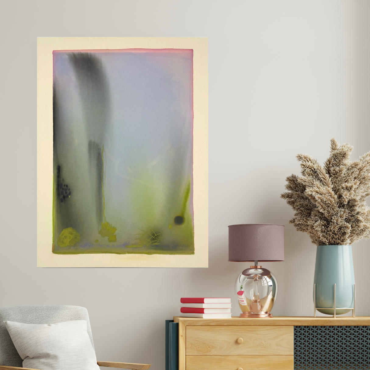 Abstract art piece on a wall above a wooden side table with decorative items.