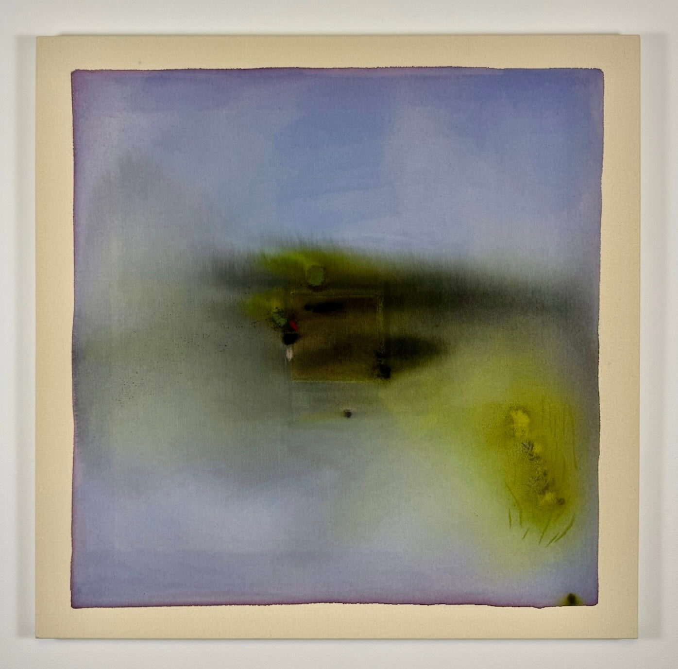 Abstract art piece with blurred colors and shapes on a beige border