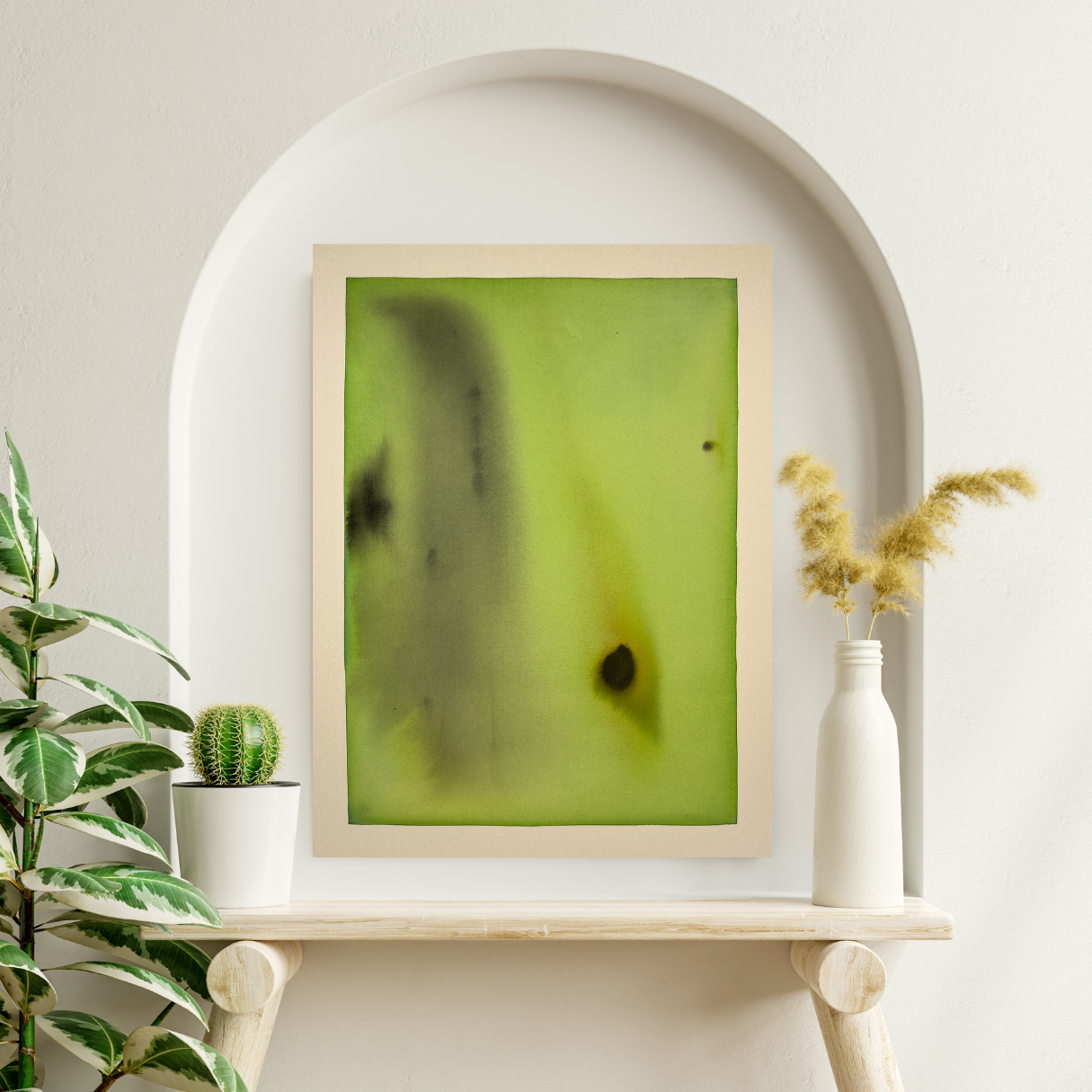 Abstract artwork with green and black colors on a white shelf with plants and a vase.